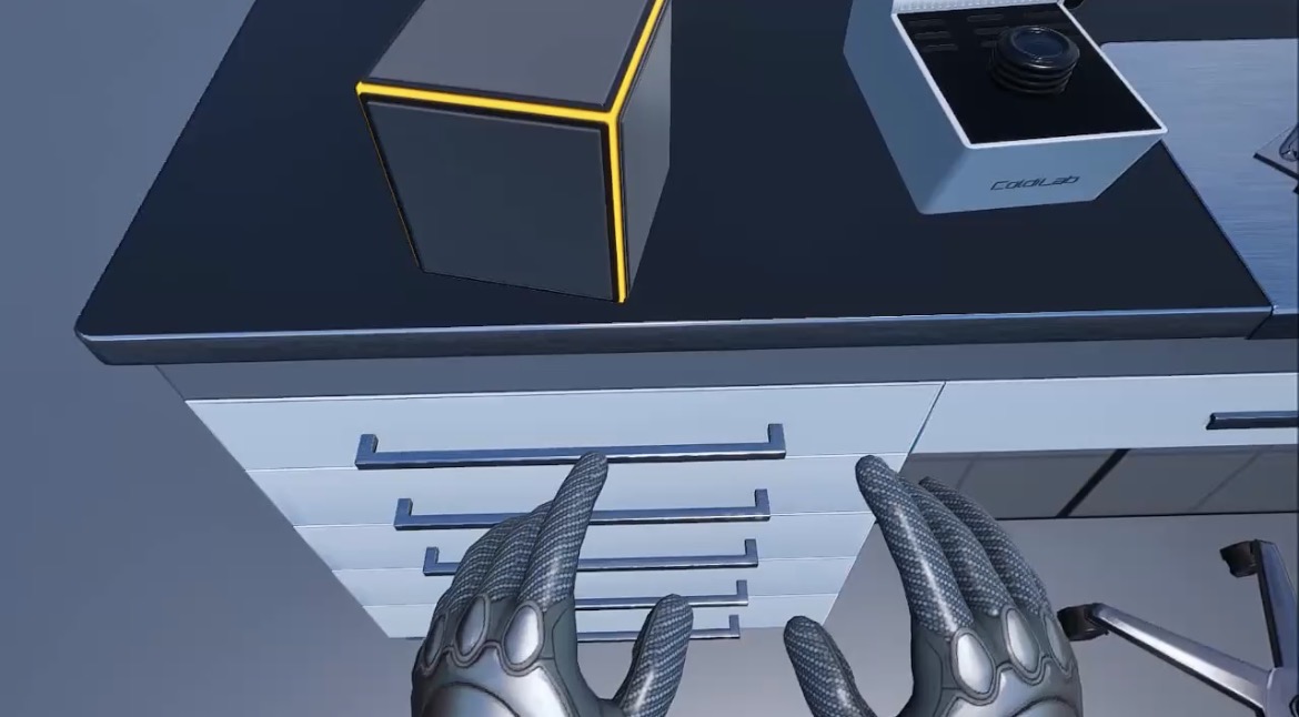 Interazione con le mani in VR su un cassetto del laboratorio